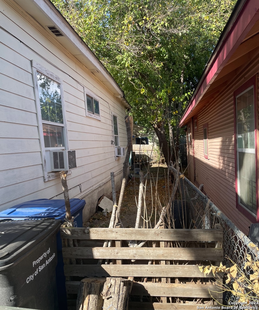 view of side of home featuring cooling unit