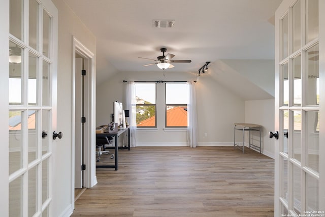 bonus room featuring ceiling fan, french doors, light hardwood / wood-style floors, and vaulted ceiling