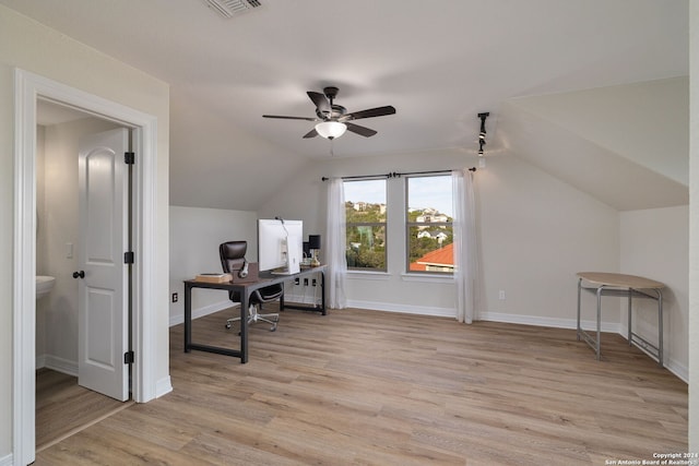 office space with vaulted ceiling, light hardwood / wood-style flooring, and ceiling fan