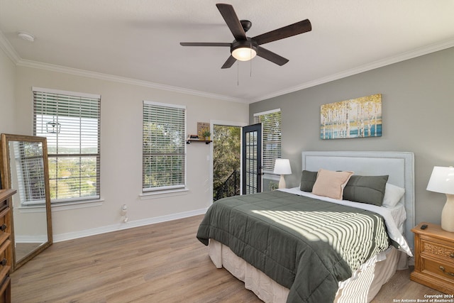 bedroom featuring ceiling fan, light hardwood / wood-style floors, and ornamental molding