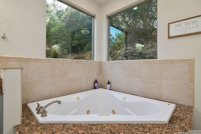 bathroom featuring tiled bath