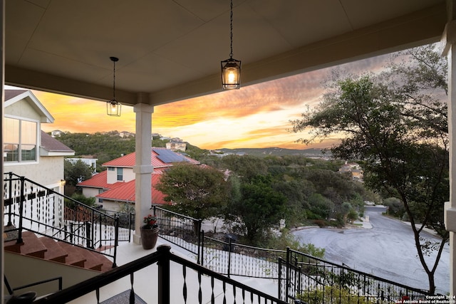 view of balcony at dusk