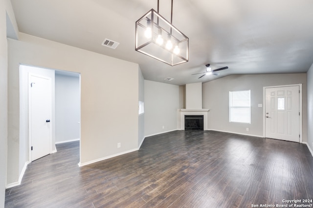 unfurnished living room with lofted ceiling, ceiling fan, and dark hardwood / wood-style floors