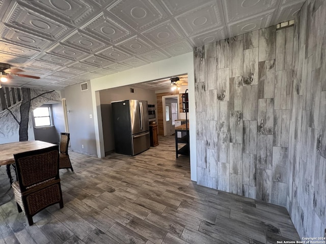 interior space featuring ceiling fan and hardwood / wood-style flooring