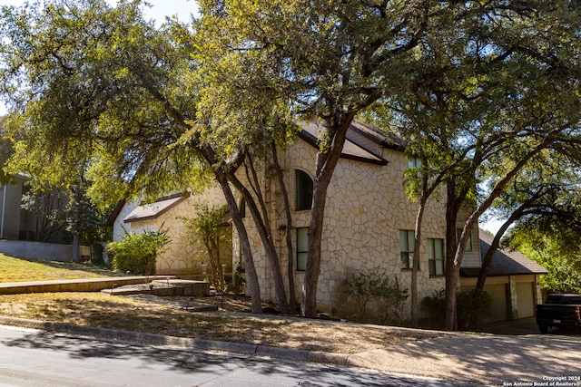 view of side of property with a garage