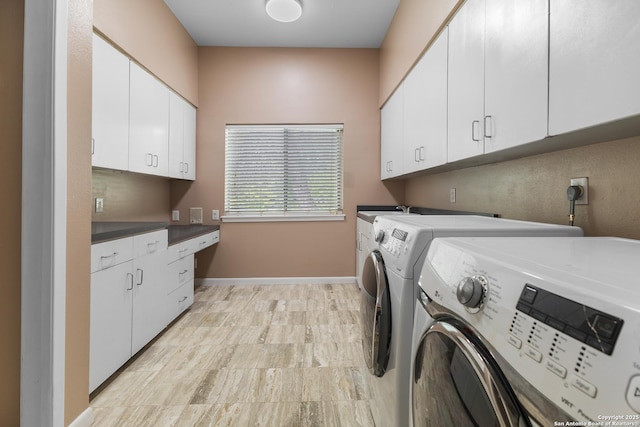 206 Bluff Holw, San Antonio, TX 78216 - laundry room featuring cabinet space, washer and dryer, and baseboards