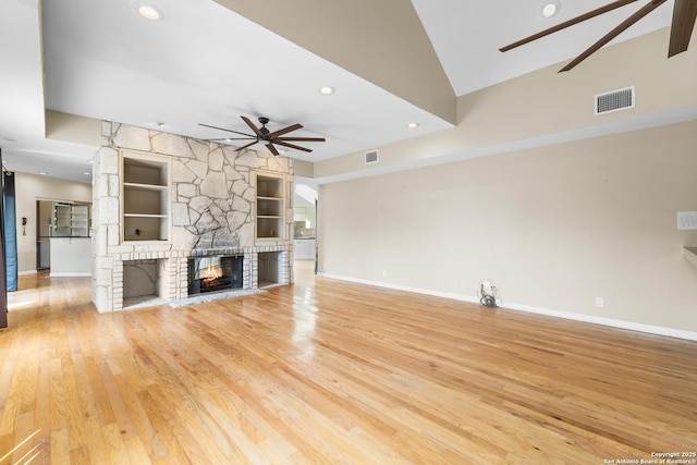 206 Bluff Holw, San Antonio, TX 78216 - unfurnished living room with ceiling fan, built in features, a fireplace, baseboards, and vaulted ceiling