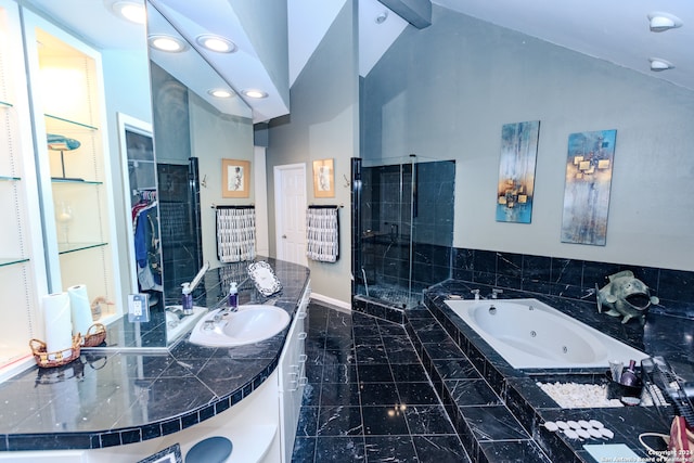 bathroom featuring shower with separate bathtub, vanity, and lofted ceiling