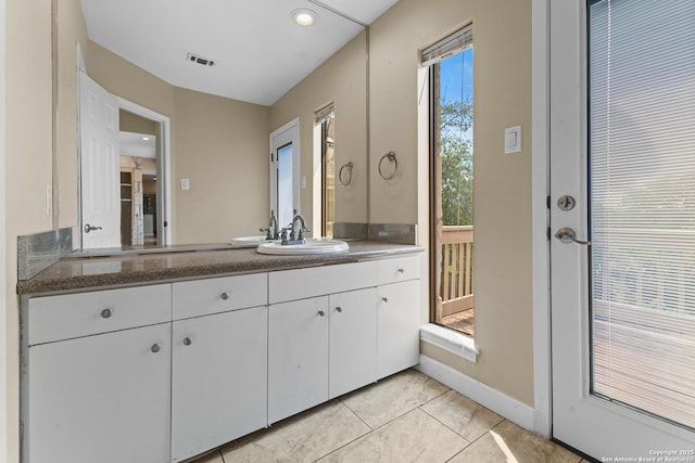 206 Bluff Holw, San Antonio, TX 78216 - bathroom with vanity, tile patterned floors, baseboards, and recessed lighting
