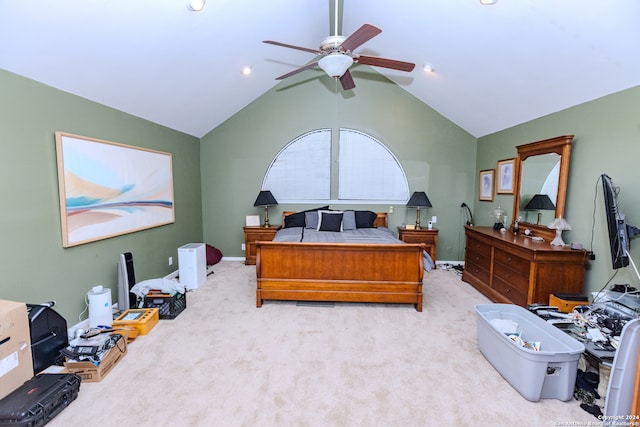 carpeted bedroom with ceiling fan and vaulted ceiling