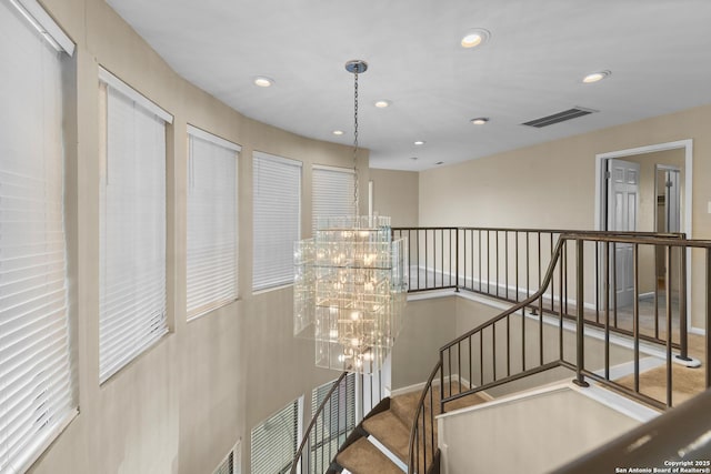 206 Bluff Holw, San Antonio, TX 78216 - stairway with a chandelier and recessed lighting