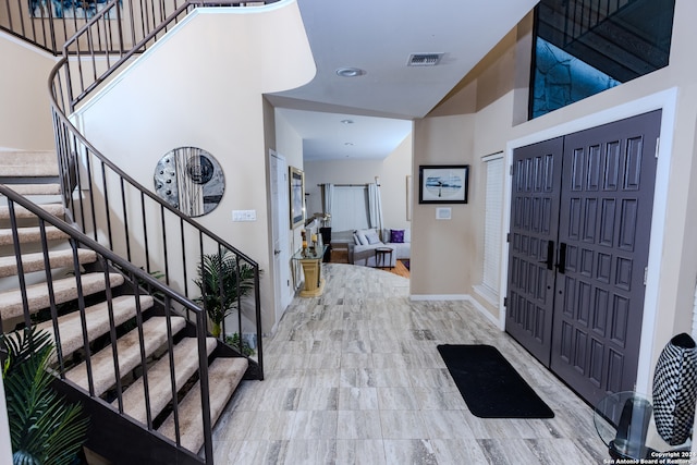 foyer featuring a high ceiling