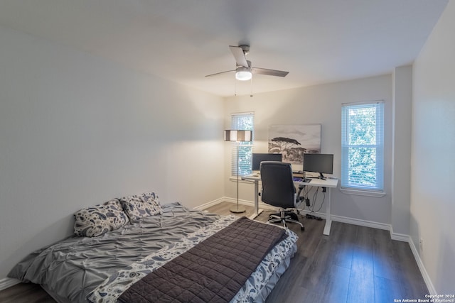 bedroom featuring dark hardwood / wood-style flooring and ceiling fan