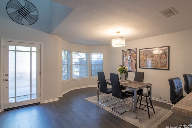 dining space featuring dark hardwood / wood-style flooring