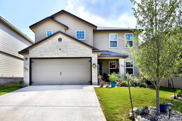 view of front of property featuring a front yard and a garage