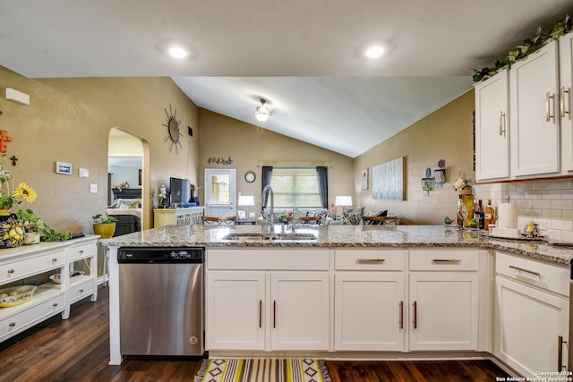 kitchen with white cabinets, sink, dishwasher, dark hardwood / wood-style floors, and lofted ceiling