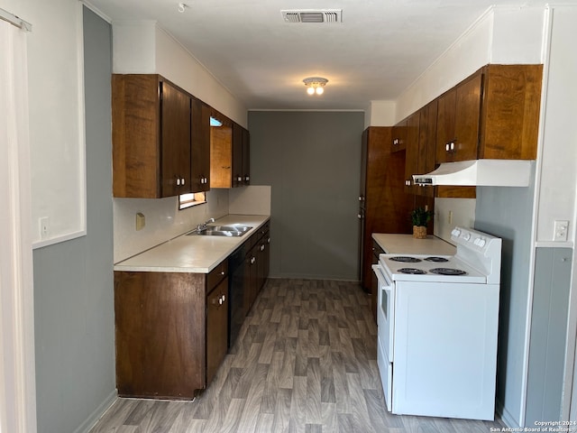 kitchen featuring dishwasher, sink, light hardwood / wood-style flooring, electric range, and dark brown cabinets