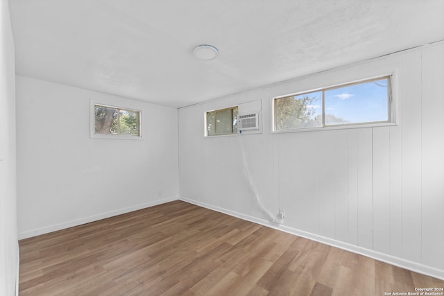 basement with light hardwood / wood-style floors