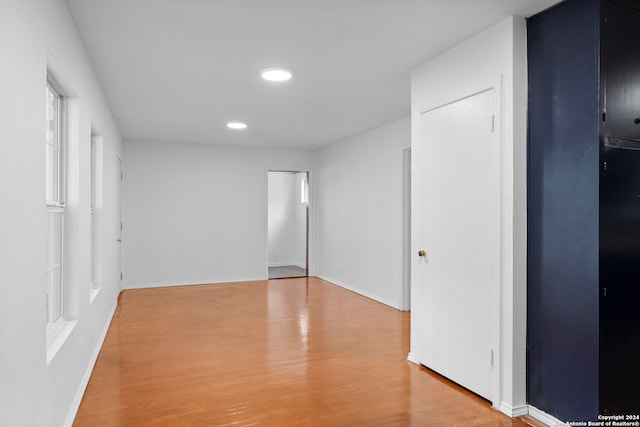 spare room with light hardwood / wood-style flooring