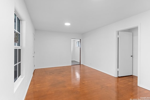 unfurnished room with wood-type flooring