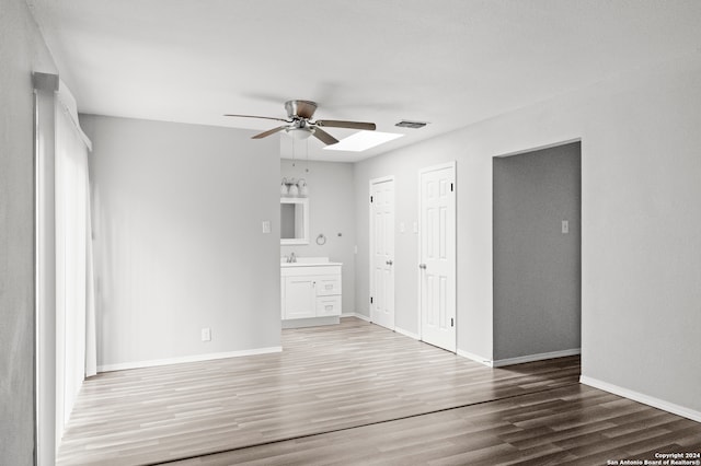 unfurnished room featuring ceiling fan and wood-type flooring