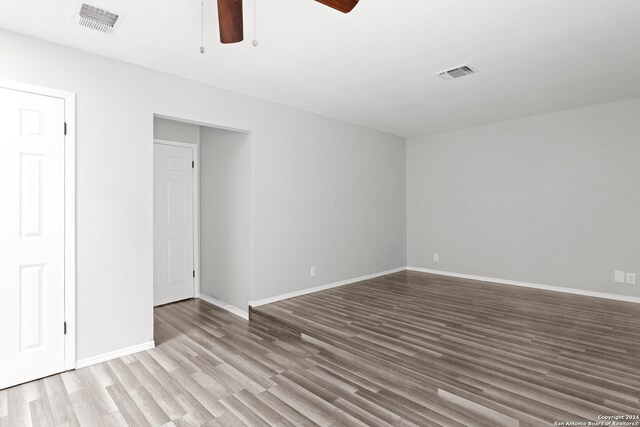 interior space with ceiling fan and hardwood / wood-style floors