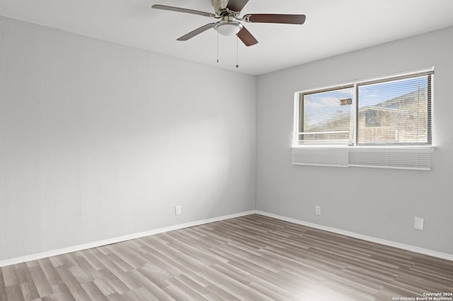 empty room featuring light hardwood / wood-style floors and ceiling fan