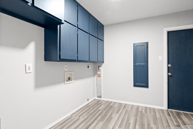 clothes washing area with cabinets, hookup for a washing machine, light wood-type flooring, electric dryer hookup, and electric panel