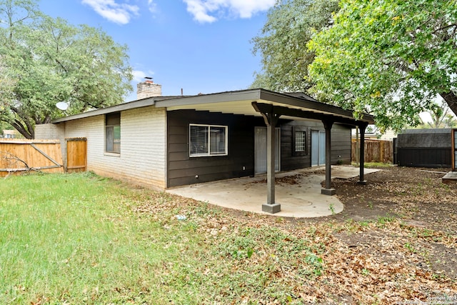 rear view of property featuring a patio area