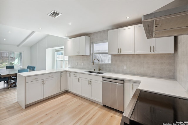 kitchen with stainless steel appliances, white cabinetry, light hardwood / wood-style floors, and sink