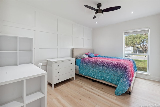 bedroom featuring ceiling fan and light hardwood / wood-style flooring