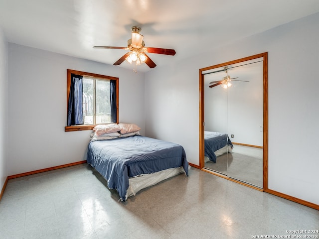 bedroom with ceiling fan and a closet