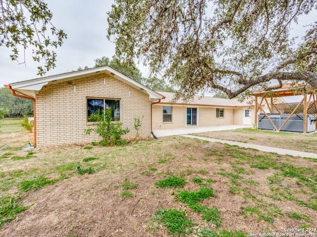 rear view of property with a patio area