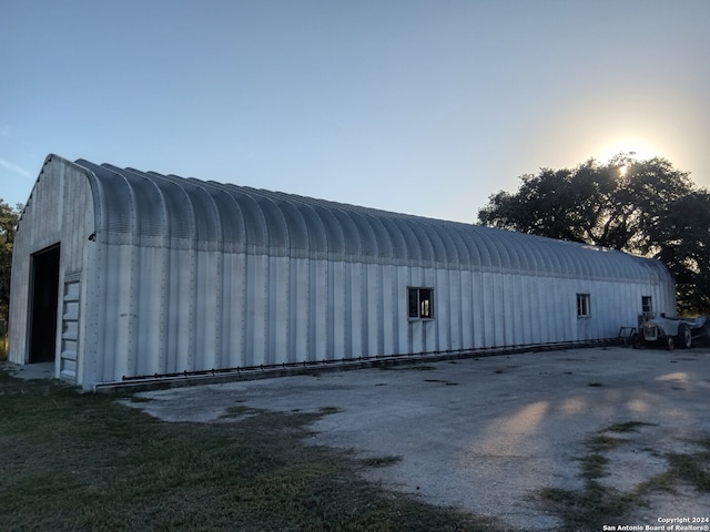 view of outdoor structure at dusk