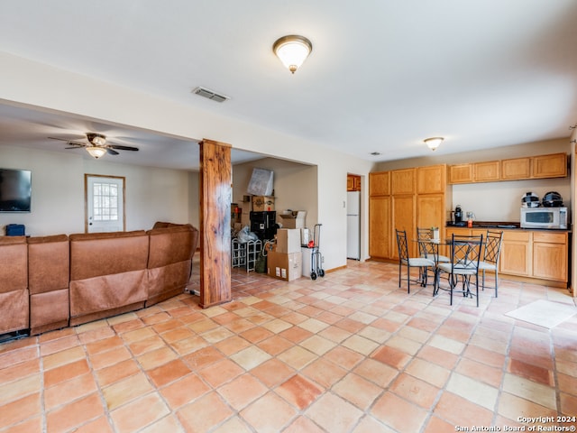 interior space featuring ceiling fan