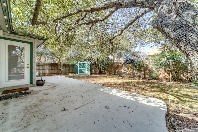 view of patio featuring a shed