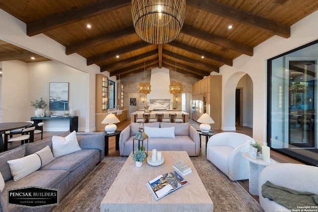 living room with wood-type flooring, lofted ceiling with beams, and wooden ceiling