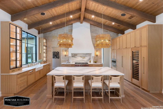 kitchen featuring sink, wooden ceiling, lofted ceiling with beams, light hardwood / wood-style floors, and extractor fan