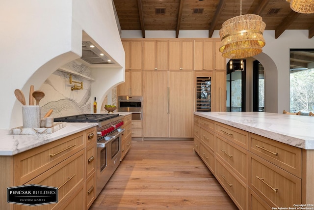 kitchen featuring beam ceiling, wooden ceiling, stainless steel appliances, and decorative light fixtures