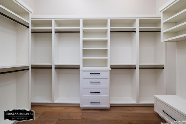 walk in closet featuring dark wood-type flooring