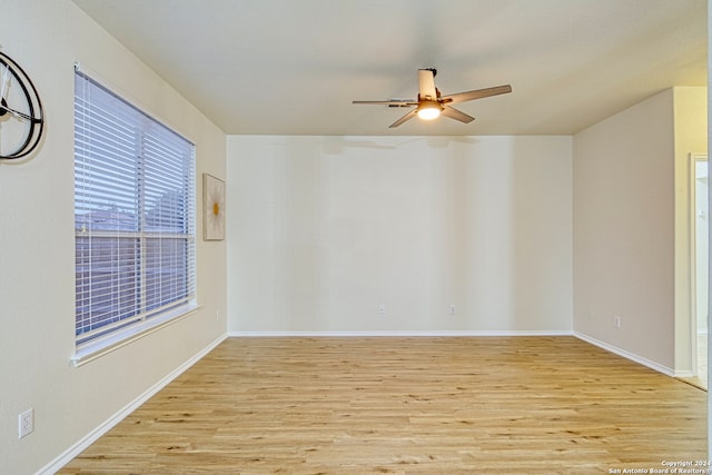 spare room featuring light hardwood / wood-style floors and ceiling fan