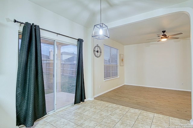 empty room featuring ceiling fan and light wood-type flooring