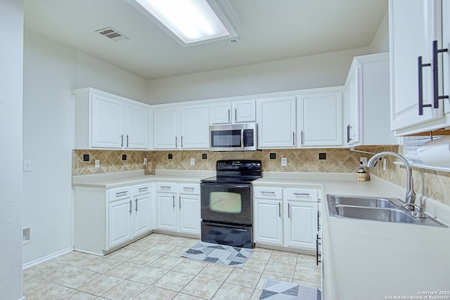 kitchen with decorative backsplash, electric range, white cabinetry, and sink