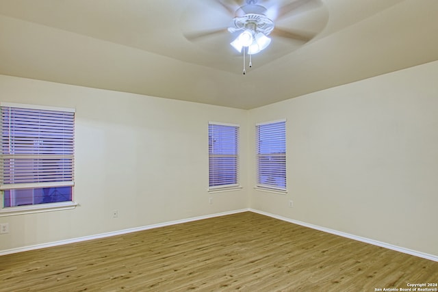 spare room featuring light wood-type flooring and ceiling fan