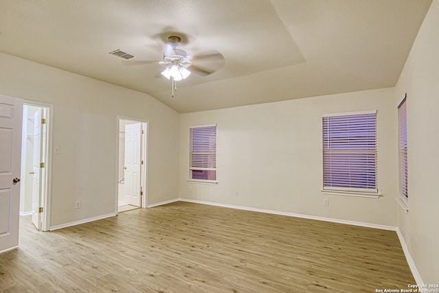 empty room featuring ceiling fan, light hardwood / wood-style floors, and lofted ceiling