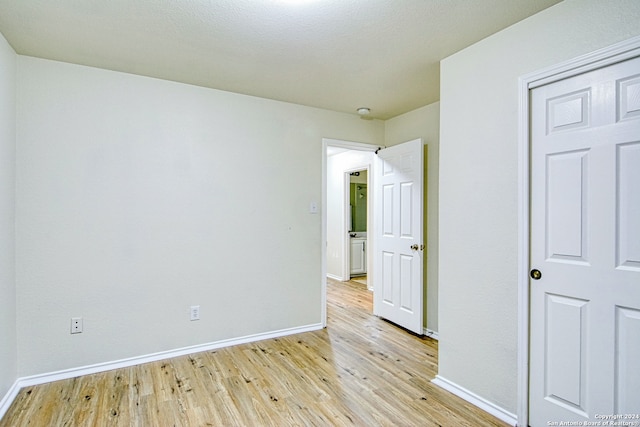 unfurnished room featuring light hardwood / wood-style floors