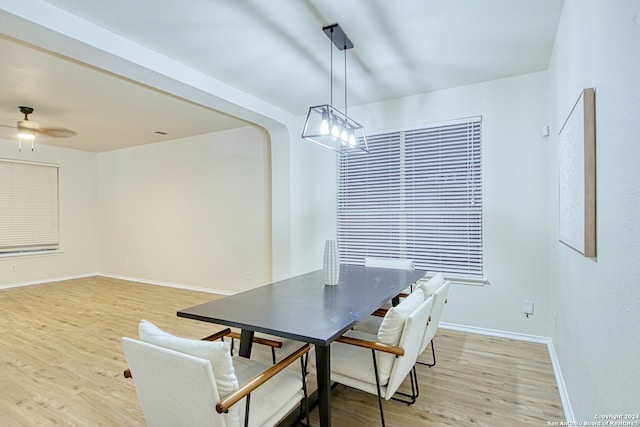 unfurnished dining area featuring ceiling fan and light hardwood / wood-style flooring