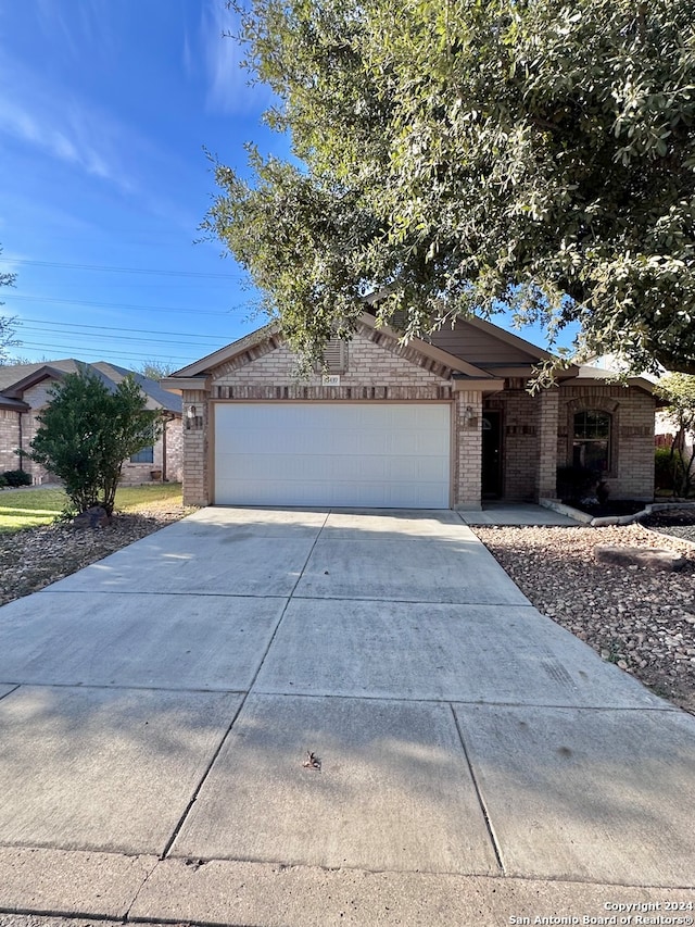 single story home featuring a garage