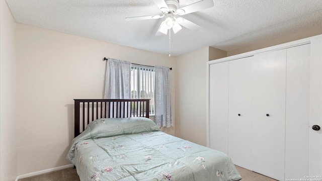 bedroom with light carpet, a closet, and ceiling fan