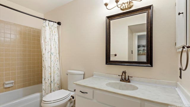 full bathroom with toilet, vanity, and shower / tub combo with curtain